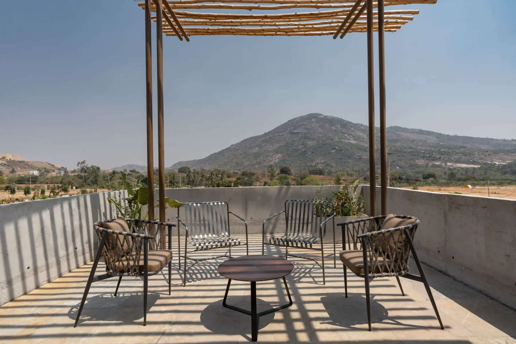 Rooftop terrace seating at Villa Maaya facing the hills