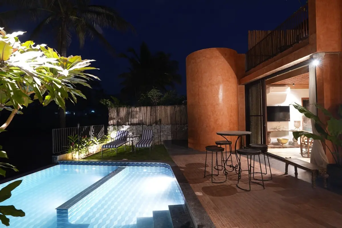 Poolside bar seating at Villa Praana in the evening